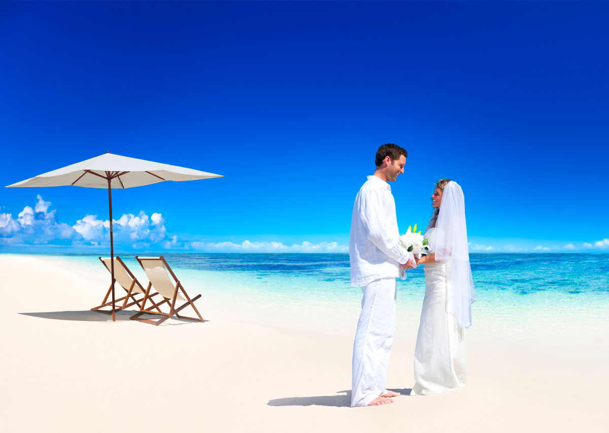 Couple getting marriage on the beach.